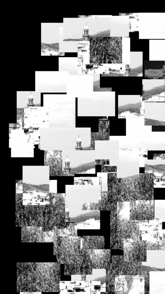 Fragmented black-and-white view across Cómpeta with the church tower and mountains